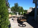 Now a Private Hessit Paver Patio with a Fire Pit and Bubbling Boulder